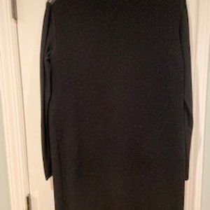 Black sweater dress with black leather on shoulder